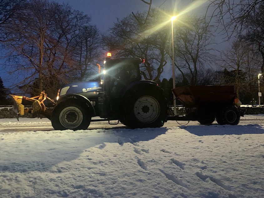 One of our tractors with snow plow and high capacity gritter in a snowy Aberdeen